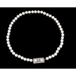 A cultured pearl and diamond necklace Cultured pearls (8,00~8,50mm) of fine orient, white gold clasp