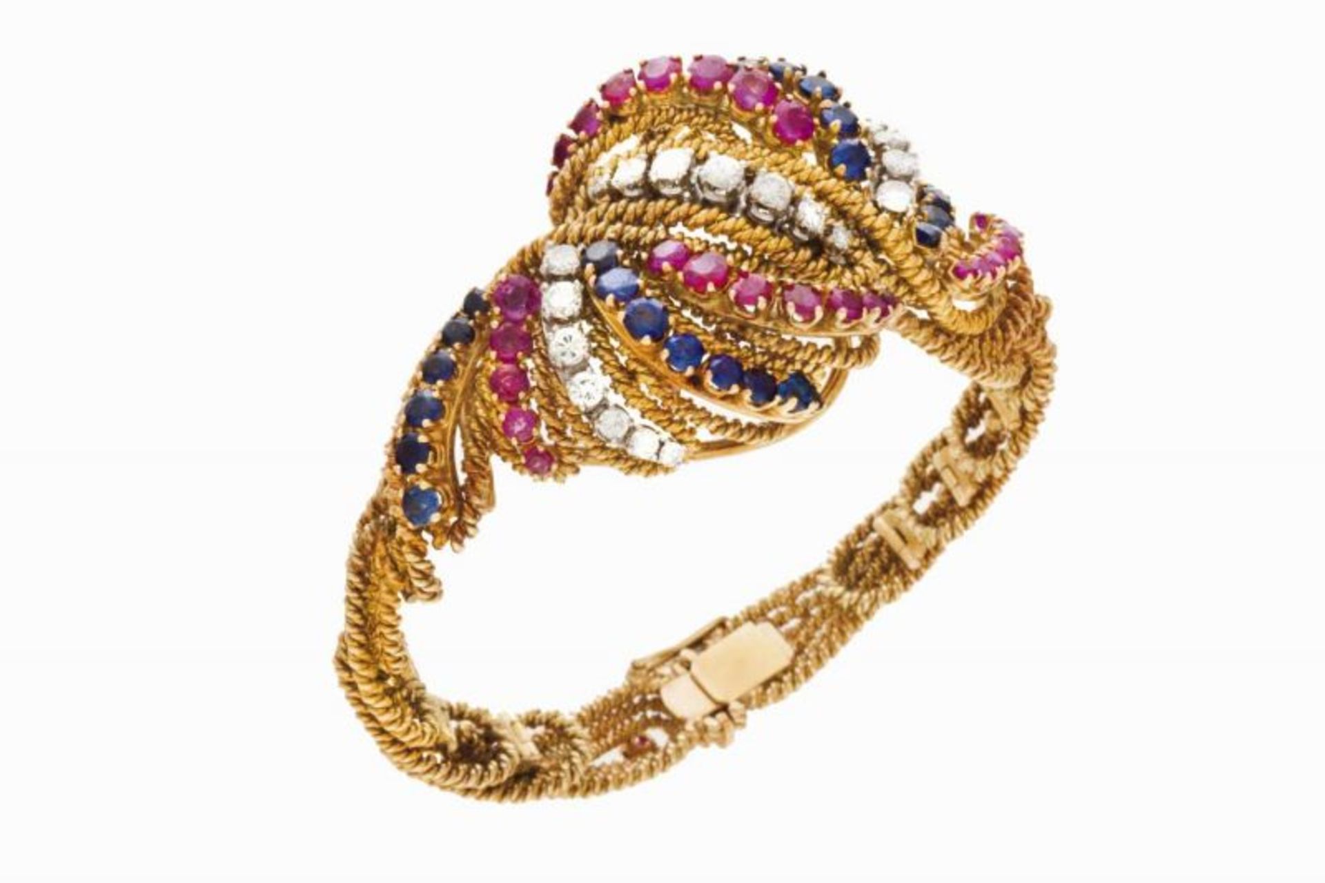 A bangle Braided twisted gold wire, centre set with brilliant cut rubies, sapphires and 21 brilliant