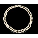 A cultured pearl sautoir Cultured pearls (8,00~9,00mm), two-toned gold clasp set with small