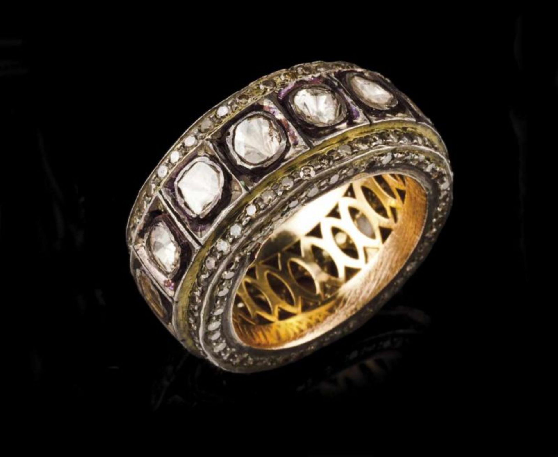 A ring 14kt gold and silver set with small single cut diamonds and foiled irregular cut diamonds