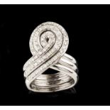 A "puzzle" ring Set in gold with 61 brilliant cut diamonds (ca. 0,50ct) Three chained "knot" rings