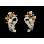 A pair of earrings 14kt two toned gold set with 46 single cut diamonds and six brilliant cut