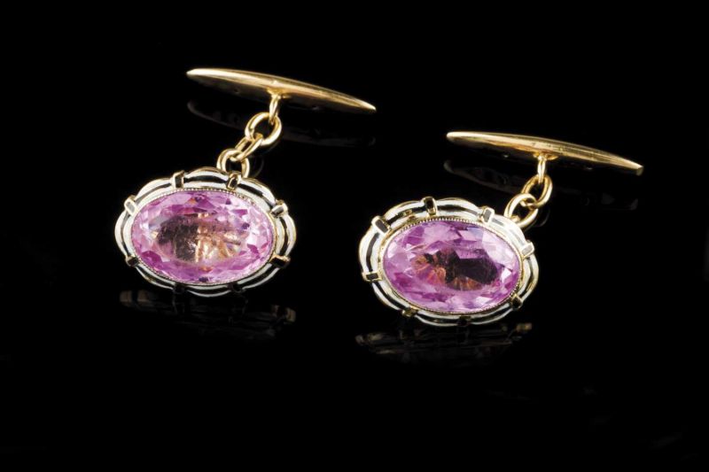 A pair of cufflinks Enamelled gold set with two oval cut pink pastes Work of the late 19th, early