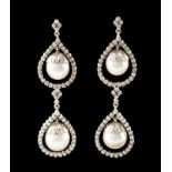 A pair of earrings White gold set with 150 brilliant cut diamonds (ca. 1,50ct) and four cultured