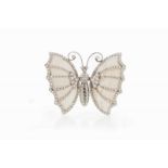 A "butterfly" brooch Set in platinum with mother-oof-pearl plaques and 170 brilliant cut diamonds