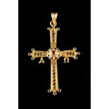 A cross-shaped pendant Set in gold with small brilliant cut diamonds, rubies, sapphires and emeralds