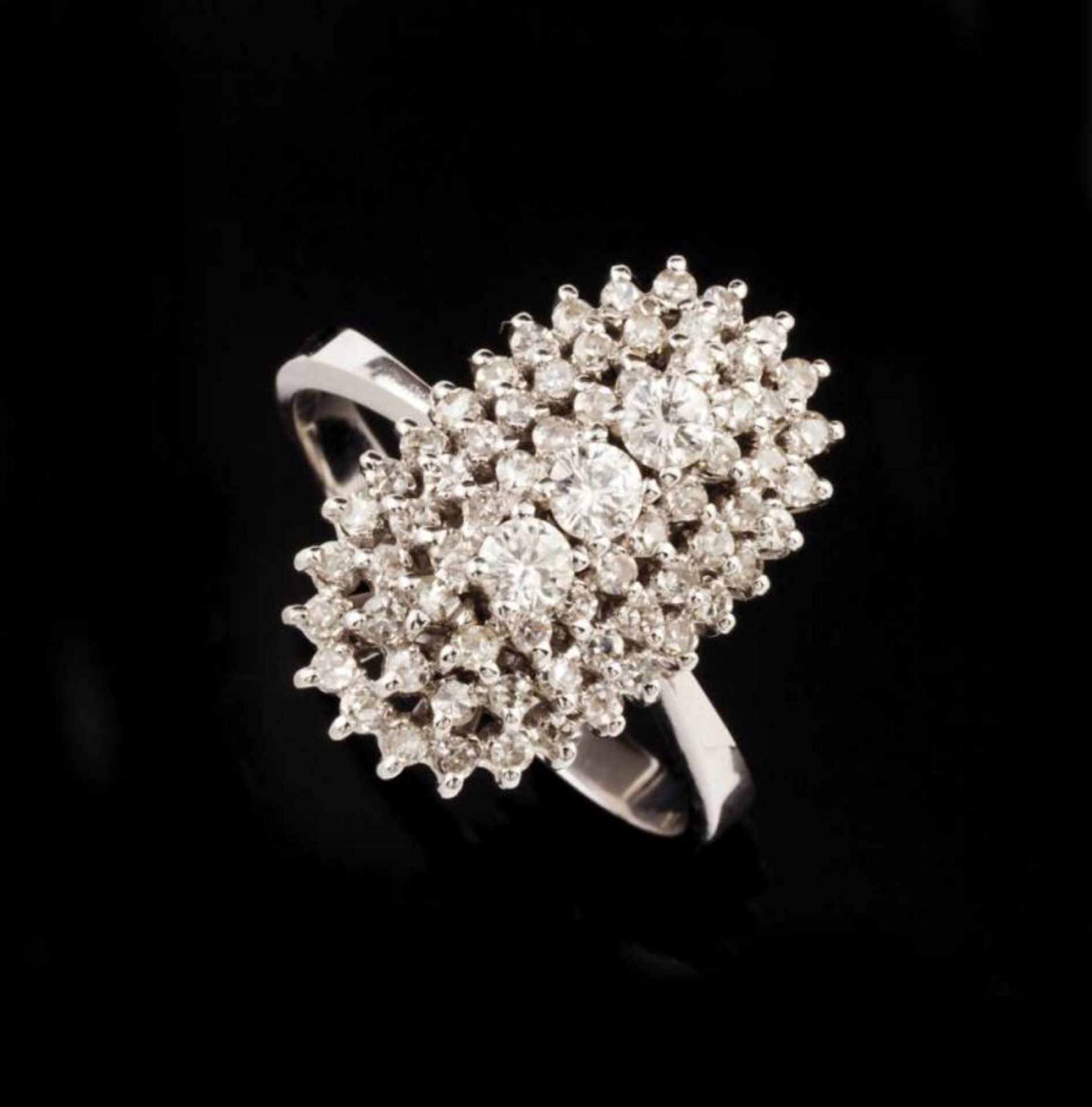 A ring Set in white gold with single cut diamonds and three brilliant cut diamonds Portuguese