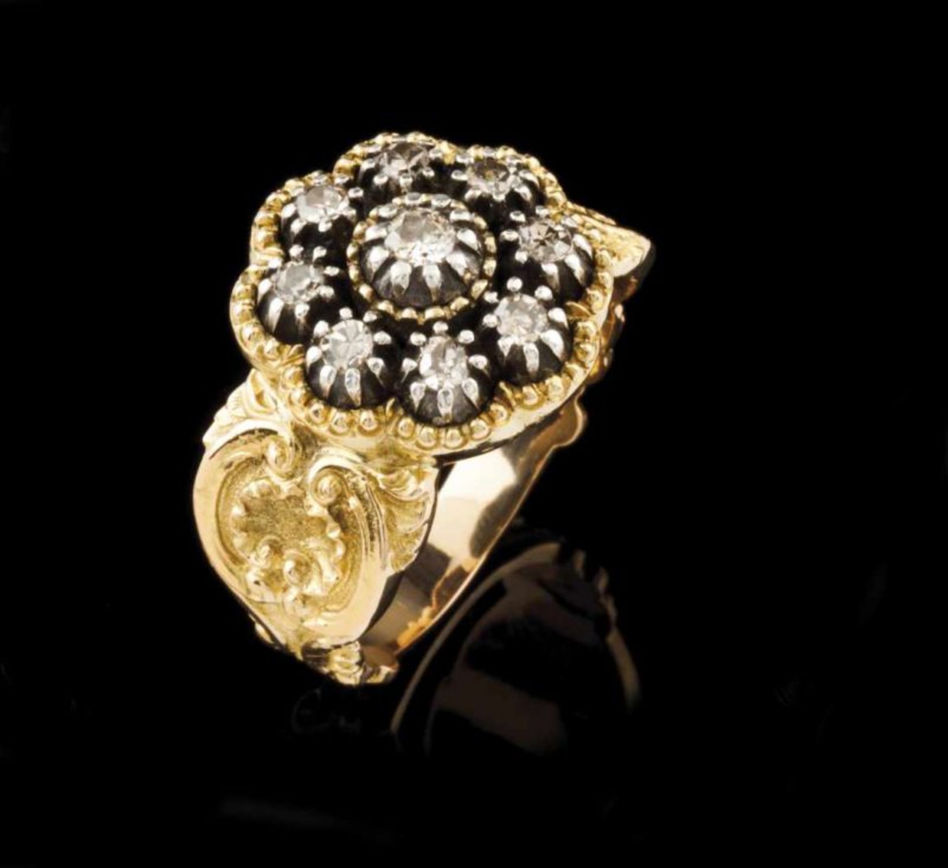 A D. João V style ring Chiselled gold decorated with volutes, shell and floral motifs, set in silver