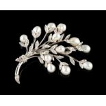 A brooch 9kt white gold set with single cut diamonds and cultured pearls, three articulated