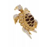 A "turtle" brooch Gold chiselled and naturalistically representing a turtle, granulated and gem-