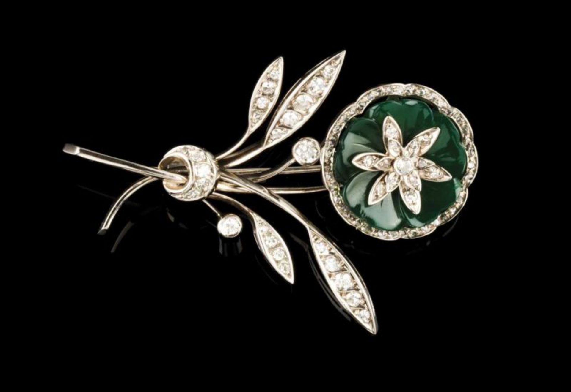 A brooch Set in white gold with rose cut diamonds, 35 single cut diamonds, three brilliant cut