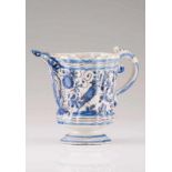 A fluted ewer Portuguese faience Blue and vinous decoration depicting rabbit, bird andd flowers