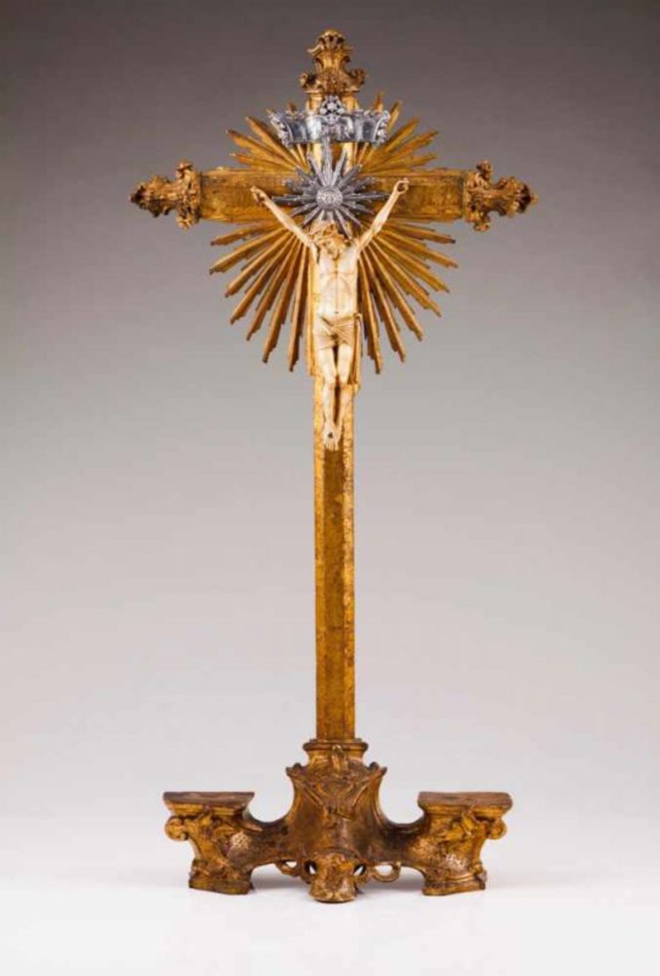 A crucified Christ Carved, polychrome and gilt wood Silver cartouche and halo Portugal, late 18th,