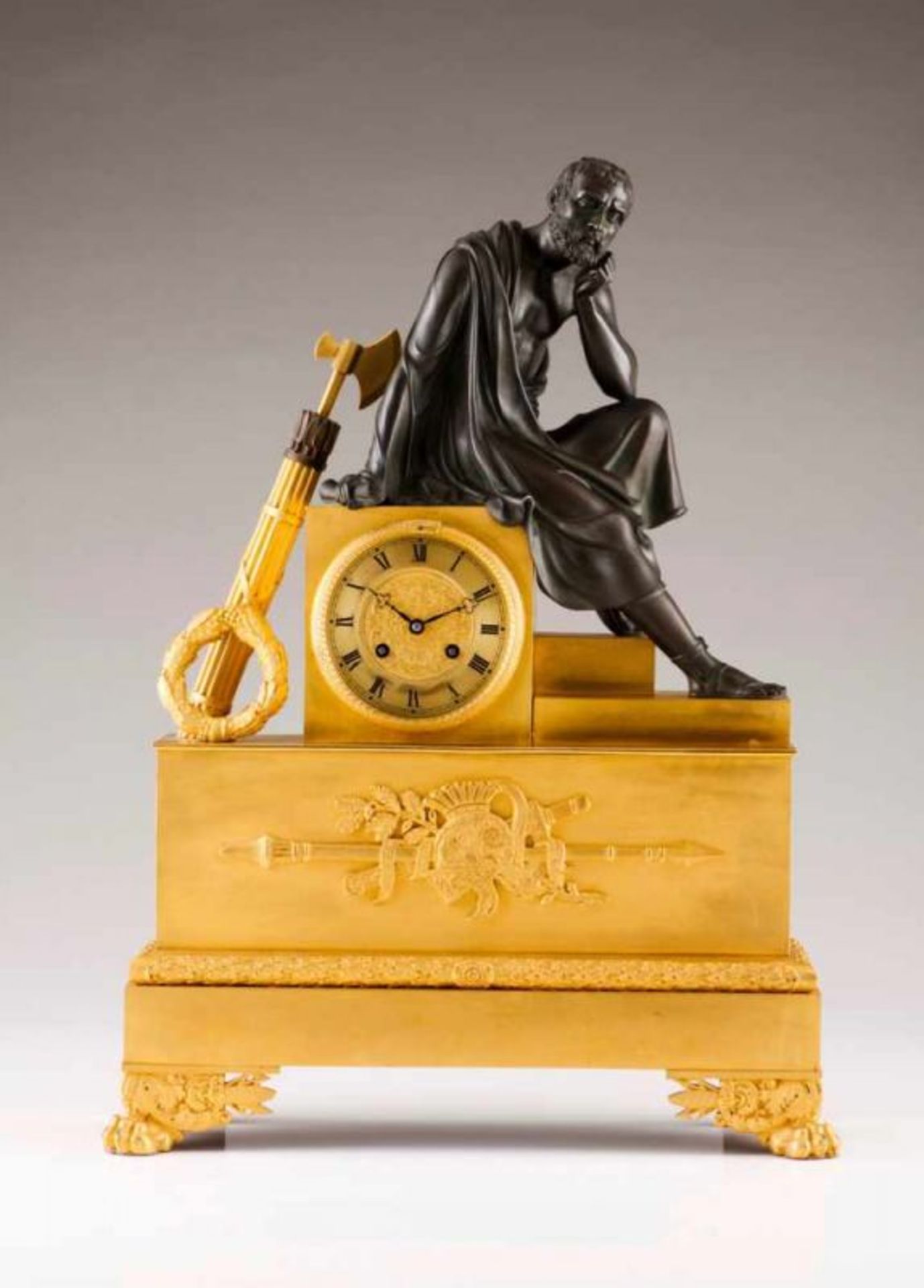 A Charles X table clock Gilt and patinated bronze Relief and chiselled decoration Dial with roman
