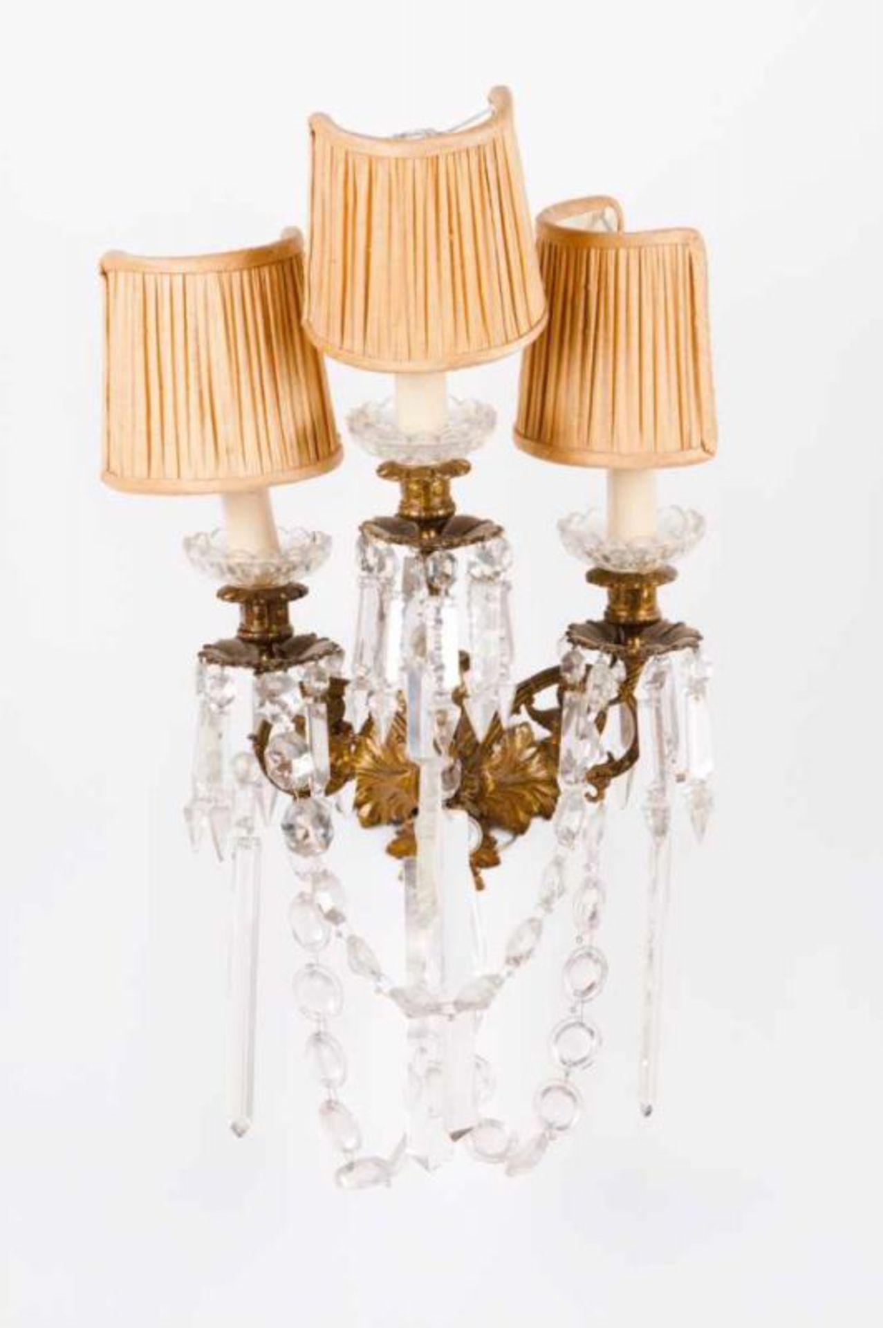 A pair of three-light wall lights Gilt metal and crystal Late 19th, early 20th century Height: 35 cm