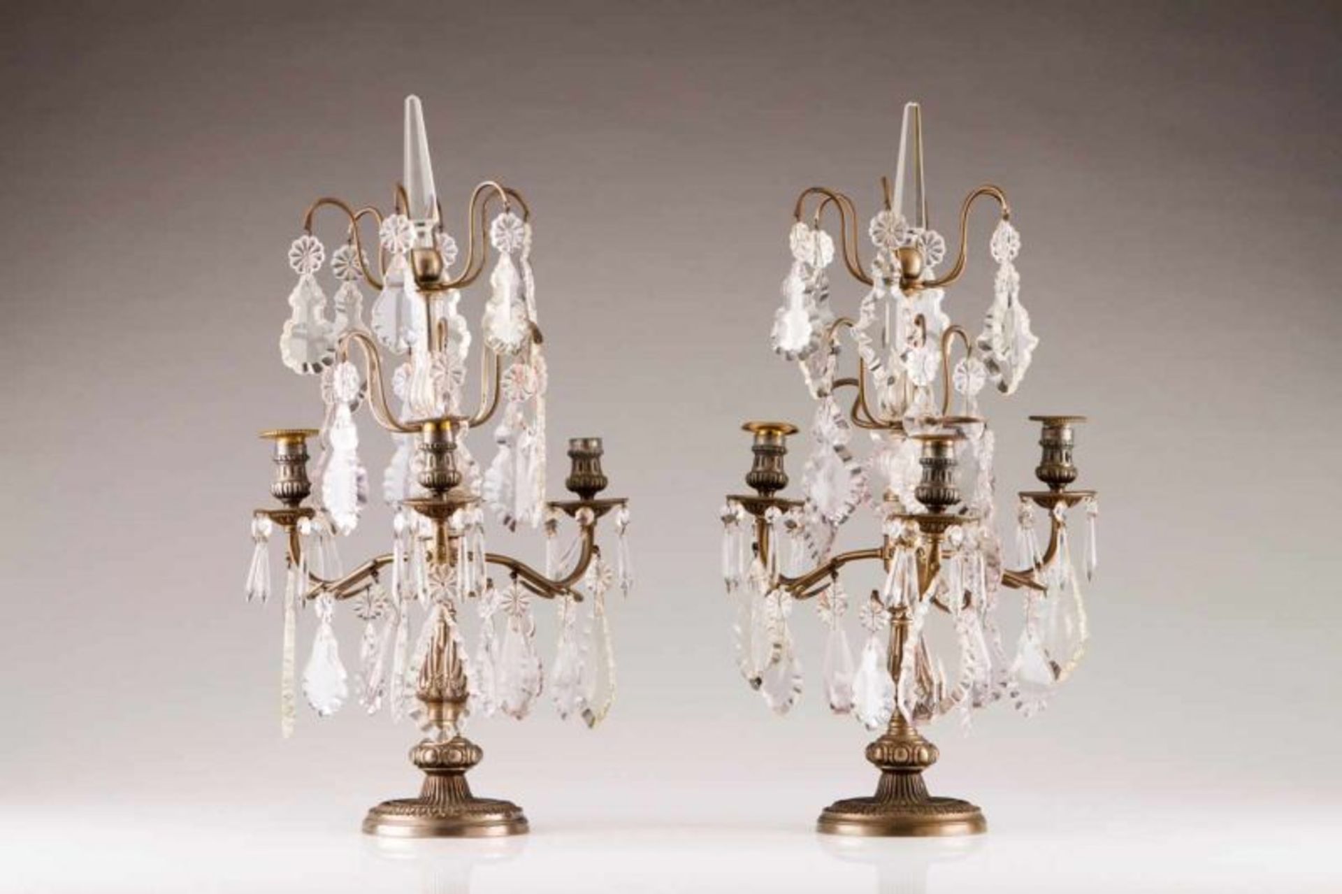 A pair of girandoles Gilt metal witg cut-glass pendants Europe, first half of the 20th century (