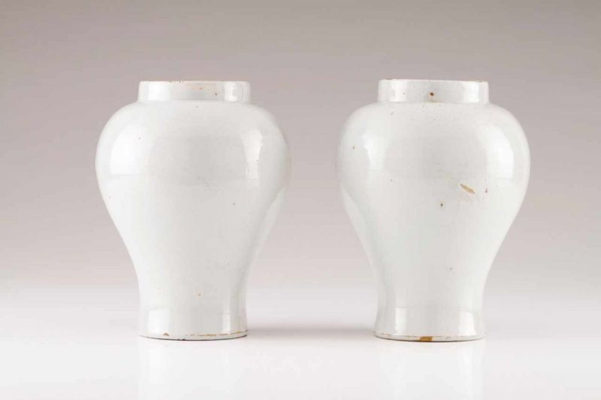 A pair of baluster vases Portuguese faience Monochrome white decoration Possibly Real Fábrica do