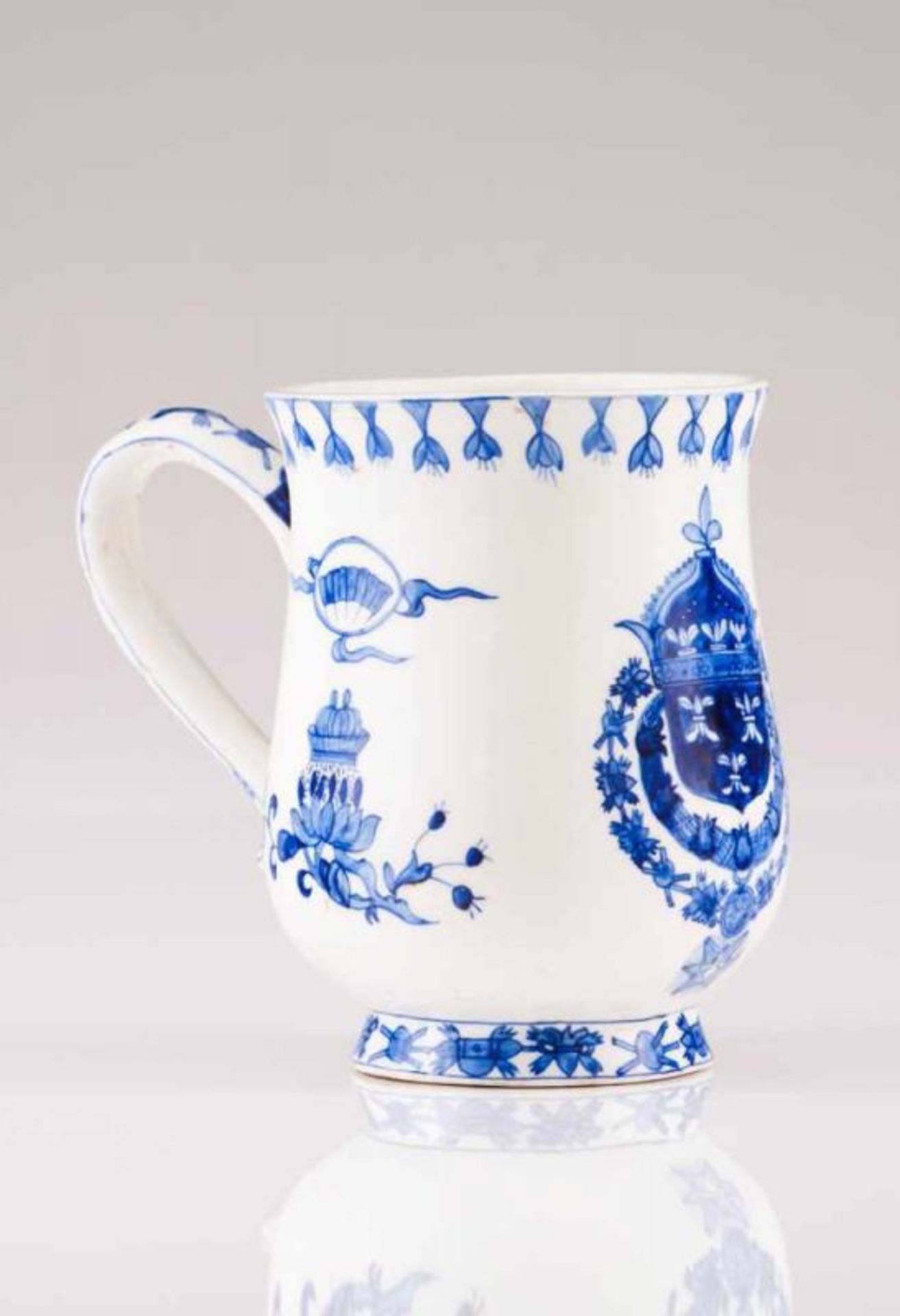 A mug European porcelain Blue decoration depicting floral motifs and French royal coat-of-arms