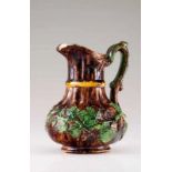 A jug Portuguese faience, Caldas da Rainha Decorated in relief with grapevines with grapes, brown