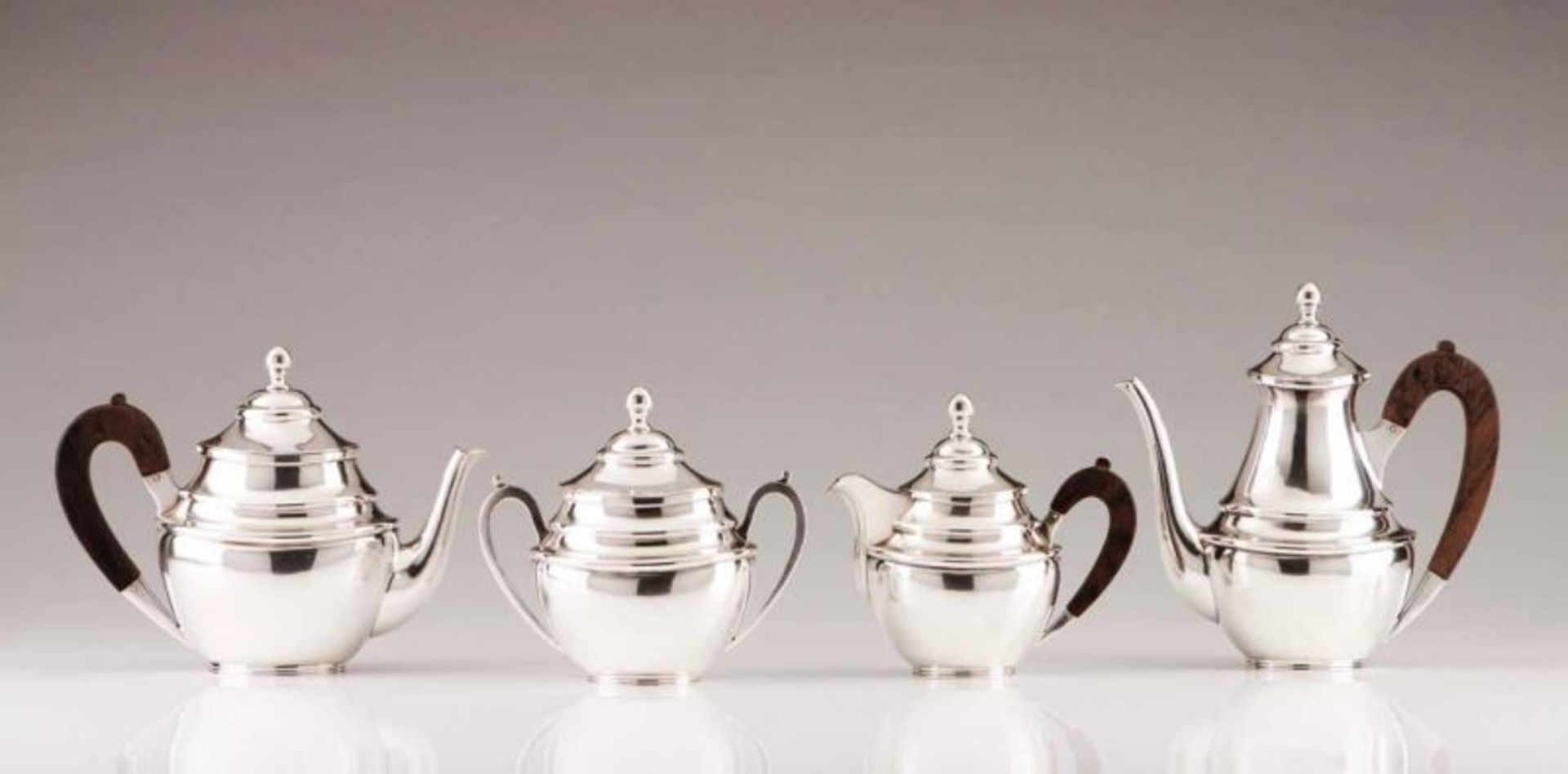 A coffee and tea service Portuguese silver D. Maria style with plain decoration and rosewood handles