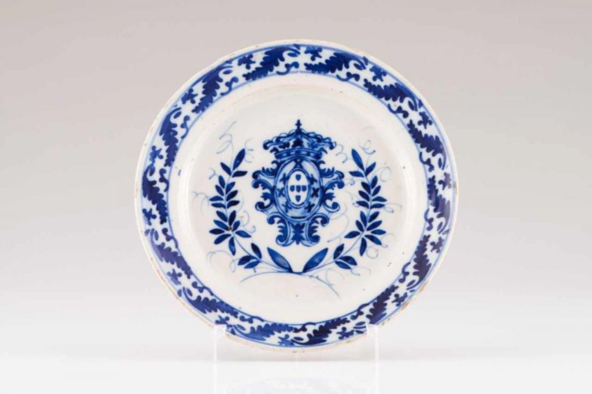 A plate Portuguese faience Blue decoration, centre bearing Portugal's coat-of-arms and floral motifs