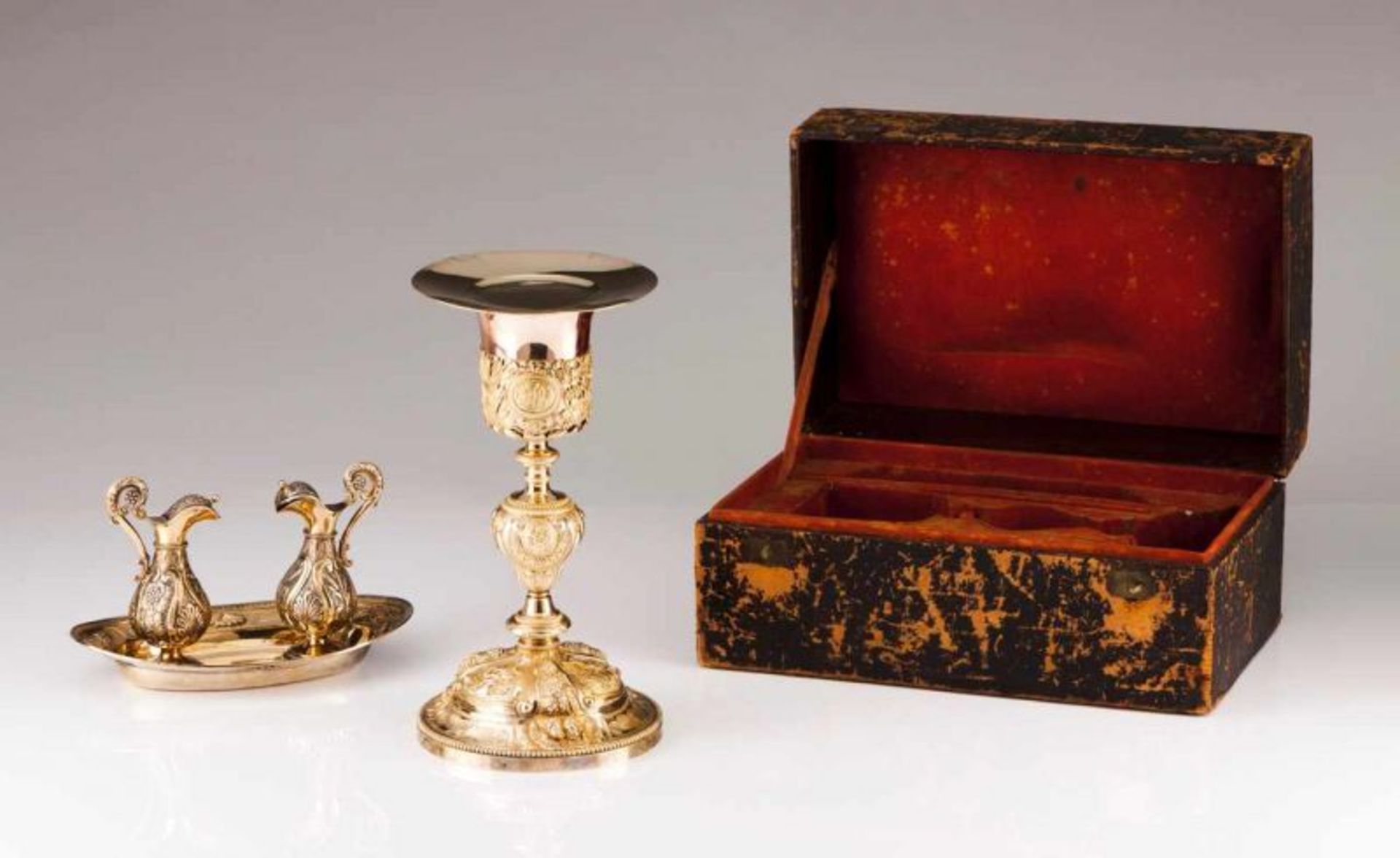 A chalice with paten and tray with altar cruets French silver gilt of the 19th century Chalice