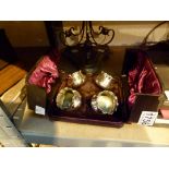 Four boxed silver plated open salts and