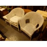 Two large cane armchairs and a table