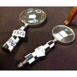 Two black and white magnifying glasses