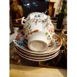 Four Chinese hand painted cups and saucers, one saucer reassembled,