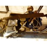 Shelf of mixed items including pictures, dolly peg,