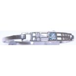 Sterling silver Celtic bangle set with blue topaz