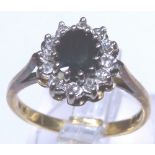 Sapphire and diamonds set in 18 ct yellow gold ring, Size M.