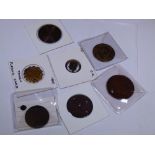 Seven coin tokens including UK blank