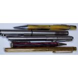 Five pencils and pens including Shaeffer fountain pen