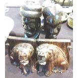 Pair of hand carved African lion book ends and a pair of African ebony busts