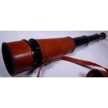 Brass telescope in brown leather case