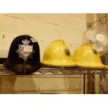 Original British Transport Police helmet and two Cumbria Fire Service helmets