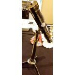 Brass telescope on tripod stand