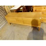 Low oak sideboard with two central drawers,