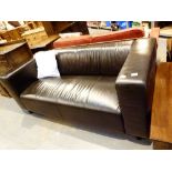 Black leather two seat settee,