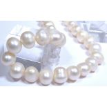 String of baroque freshwater pearls with a pearl set clasp