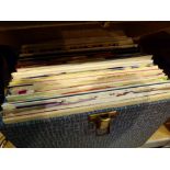 Selection of 45 rpm records including Beatles and Shadows