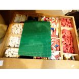 Lego wooden box containing a quantity of old Lego parts including bricks, windows,