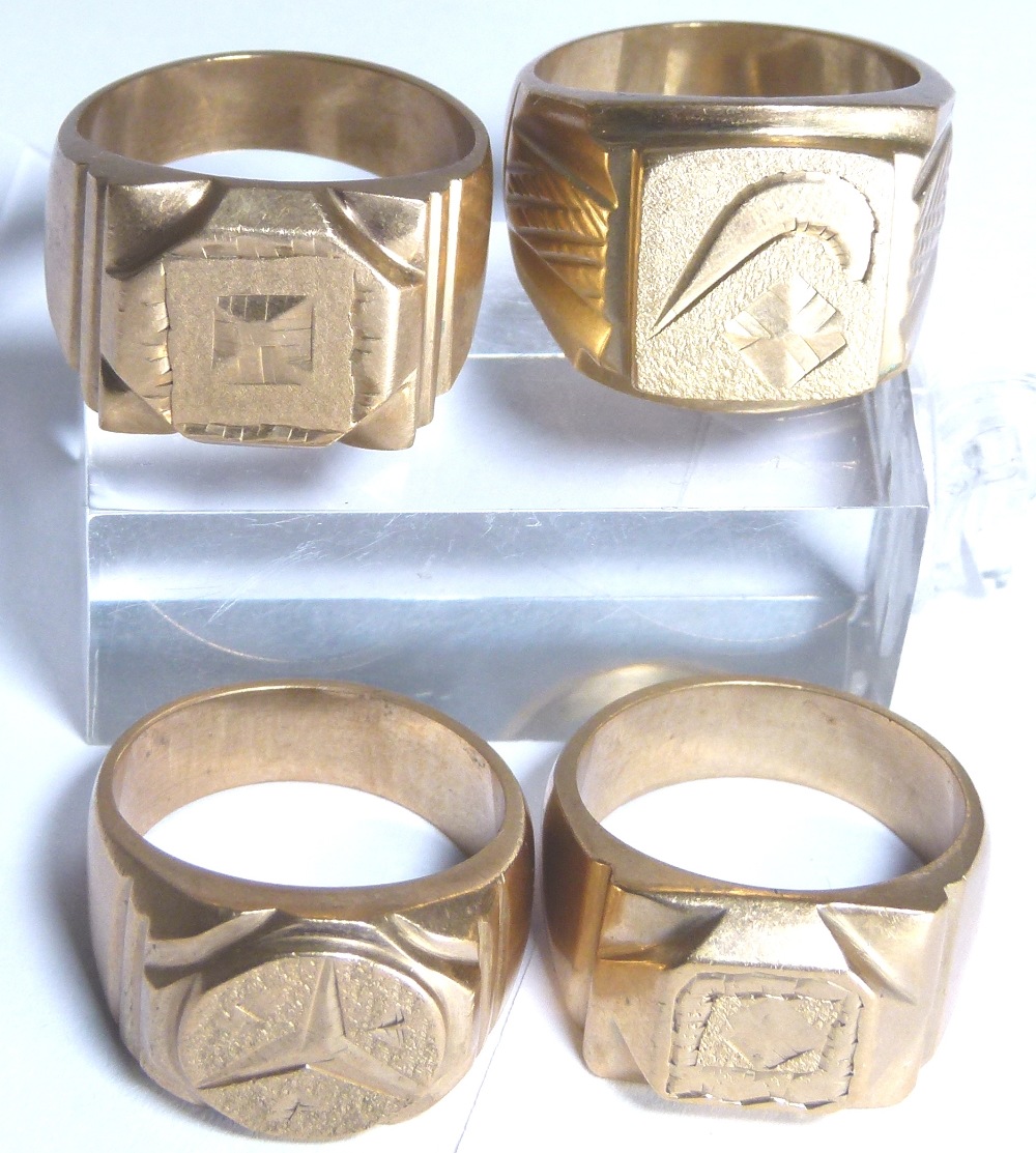 Four yellow metal rings,