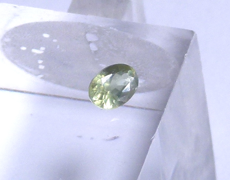 Oval cut demantoid garnet, 4.44 x 3.19 x 2.