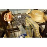 Ventriloquist doll and straw boater