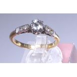 18ct gold diamond solitaire with diamond shoulders, approximately 0.