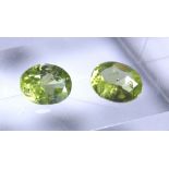 Pair of oval cut peridot stones, approximately 2.