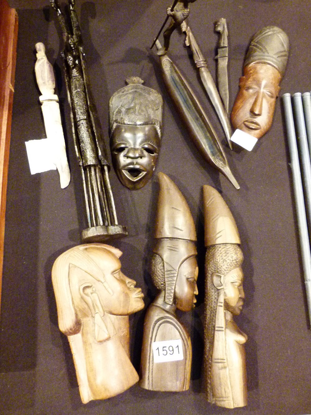 Quantity of African carvings including wooden tusks